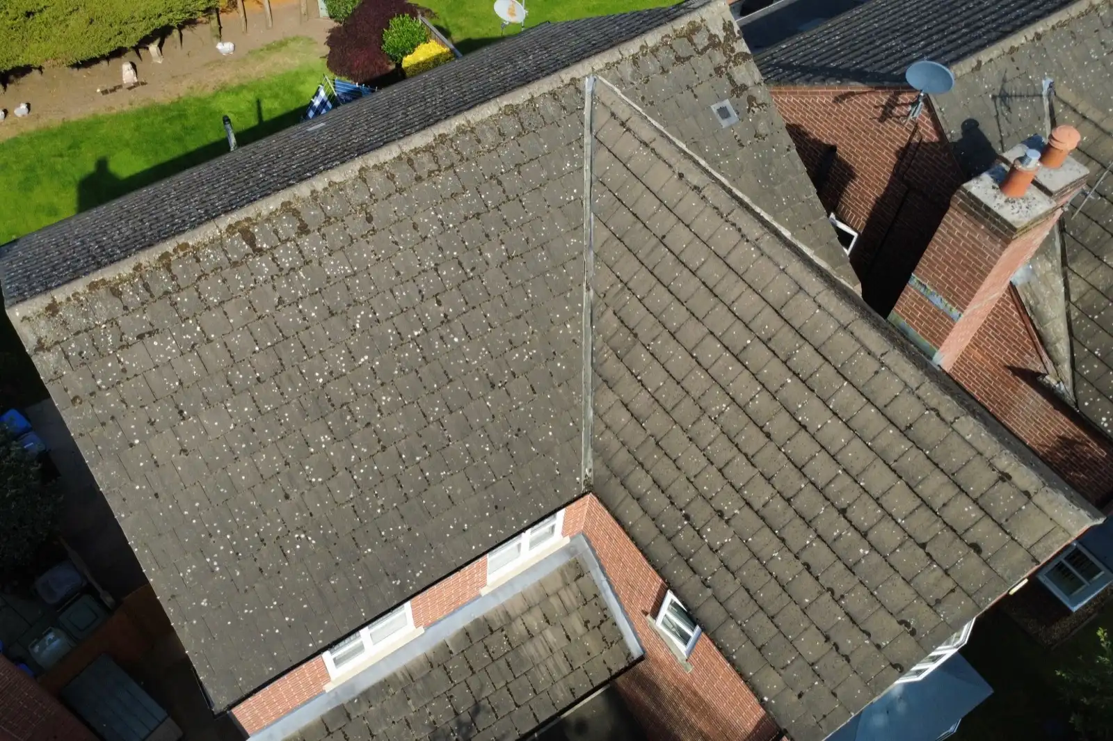 Roof covered in moss before cleaning, seen from above